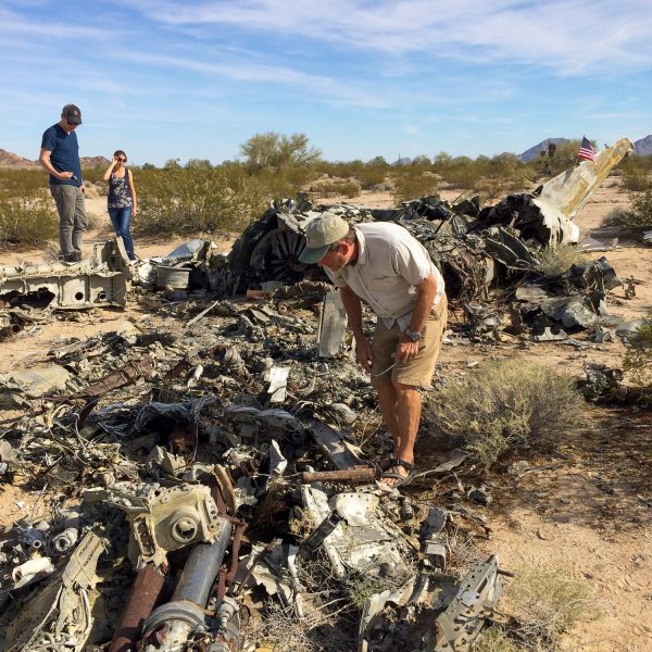 Josh, Kari, and Mark (the other Mark) look through the wreckage of an old fighter plane.