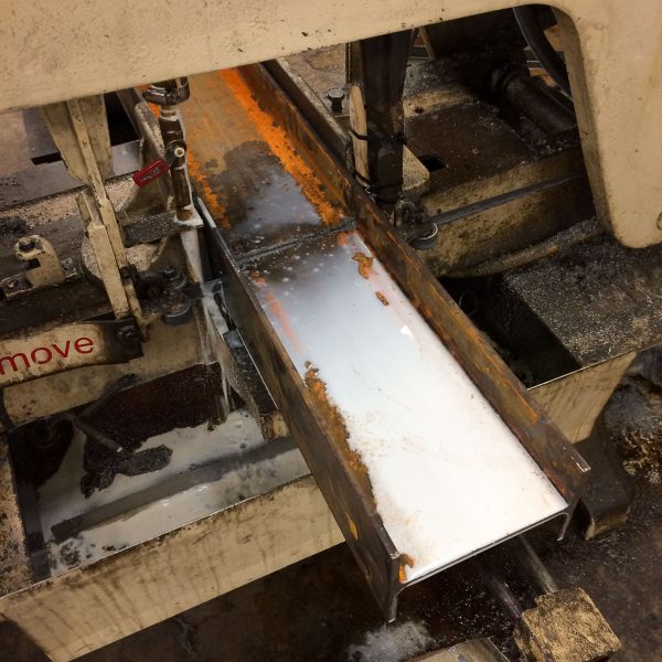 I cut my I-beam on the shop's horizontal band saw - just clamp the piece in, turn on the saw, and let gravity do the rest!