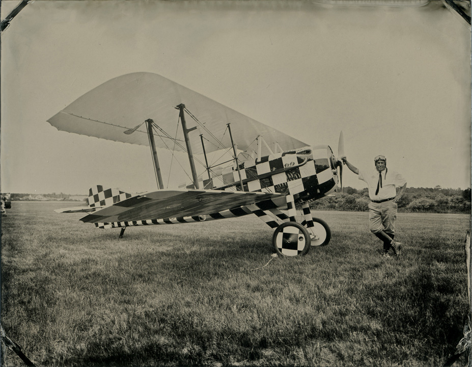 Spad XIIIc.1 biplane (replica), Richard Hornbeck, pilot. The checkered paint job is unique - the original plane was painted like this for a 3rd Army carnival (ca. 1919) in Koblenz, Germany, following the signing of the Armistice ending WWI.