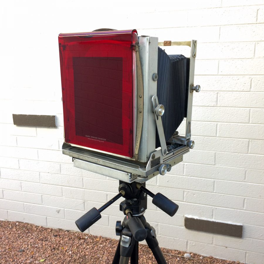 Transparent red acrylic, with my name and logo, on an Eastman Commercial View 8x10 camera.