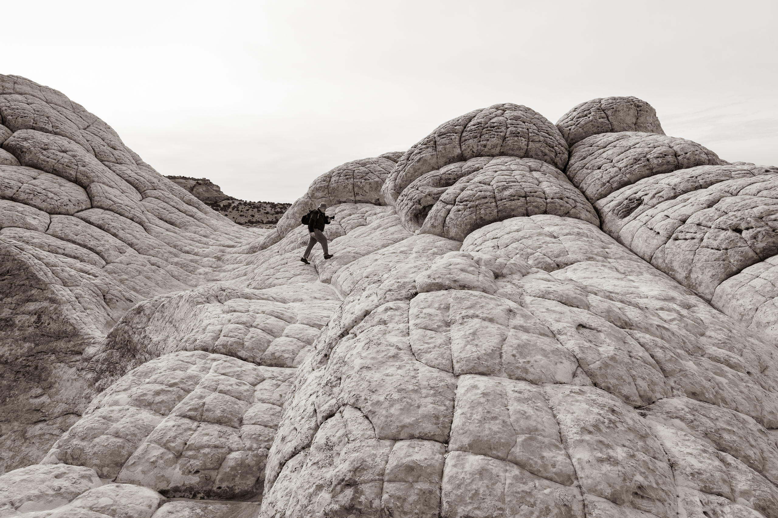 Jonathan hops across the "brain rock" at White Pocket, Arizona.