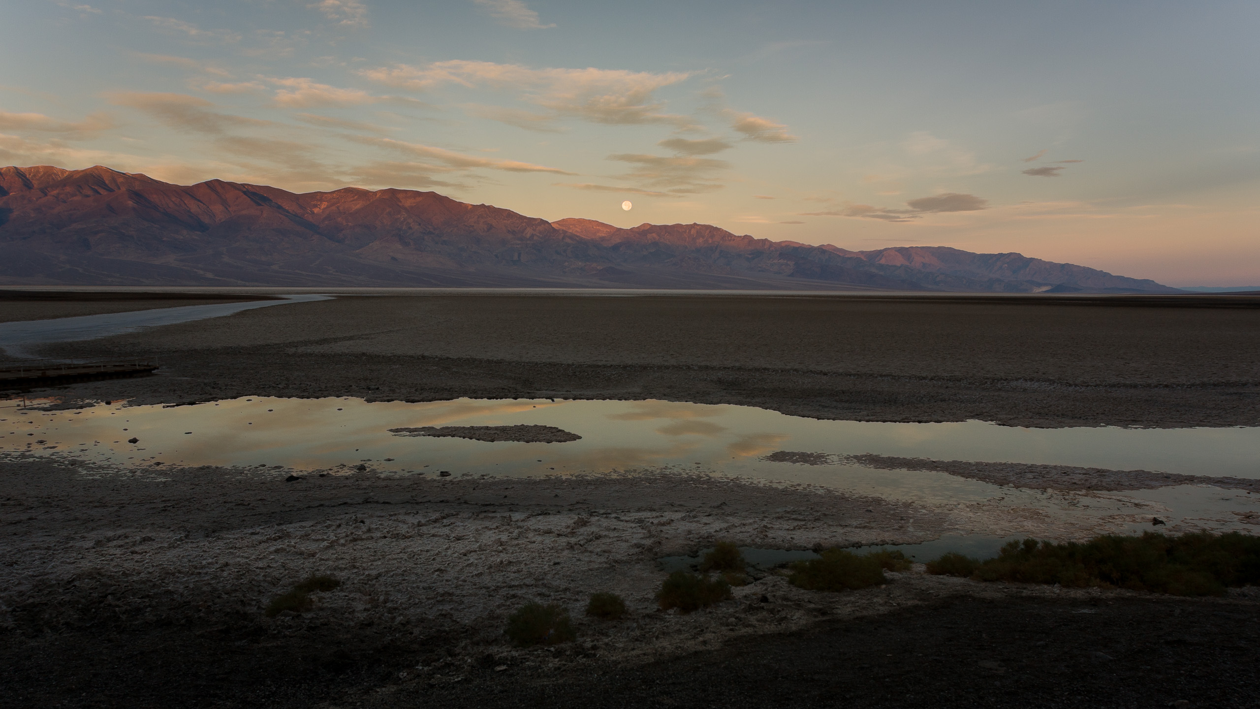 Sunrise and moonset over Badwater Basin, -282 ft elevation, Death Valley, California.